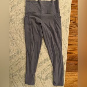 Athleta salutation stash pocket II 7/8 tight